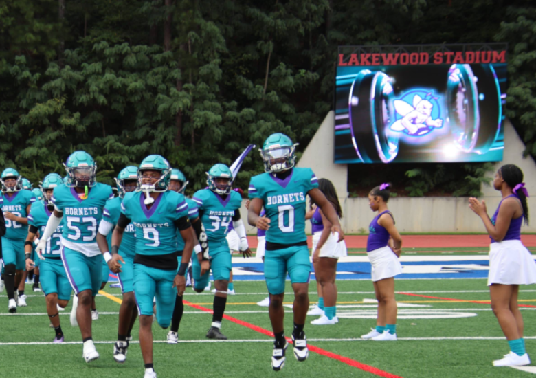 South Atlanta HS football team running on to the field at Lakewood Stadium.